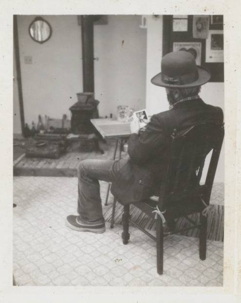 man seated with back to viewer